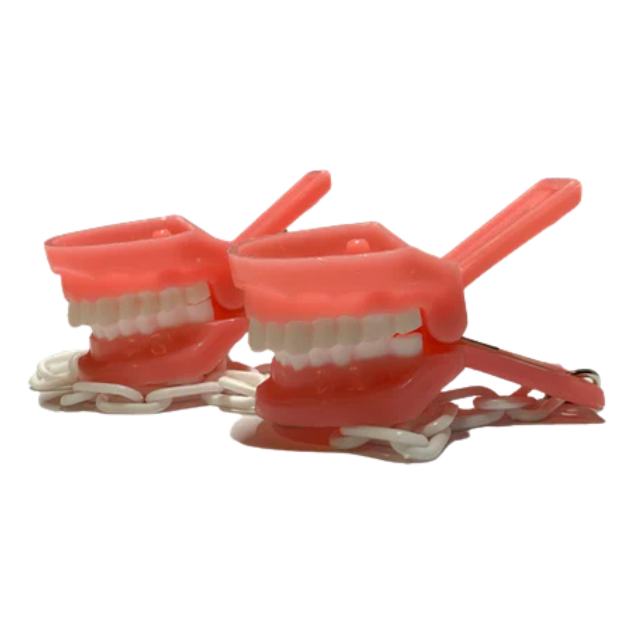 Caiman o porta toalla de tipodonto (clip dental)